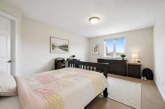 Bright bedroom with double window, virtually staged