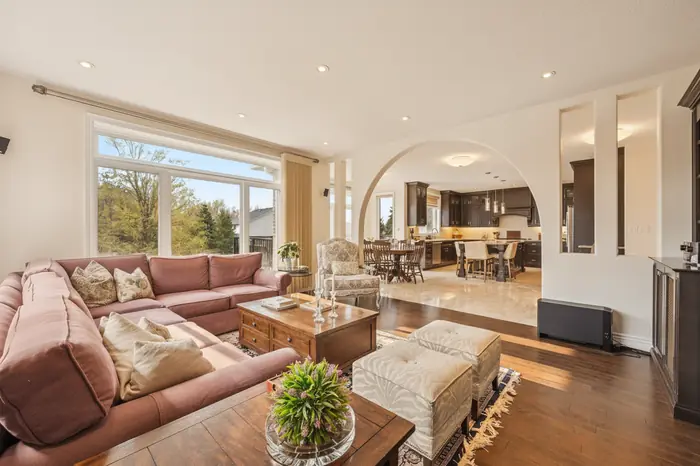 Family room open to the kitchen in warm evening light, AI-enhanced image