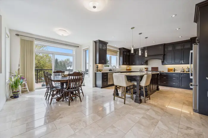 Barzotti kitchen and dinette with walkout to deck overlooking greenspace
